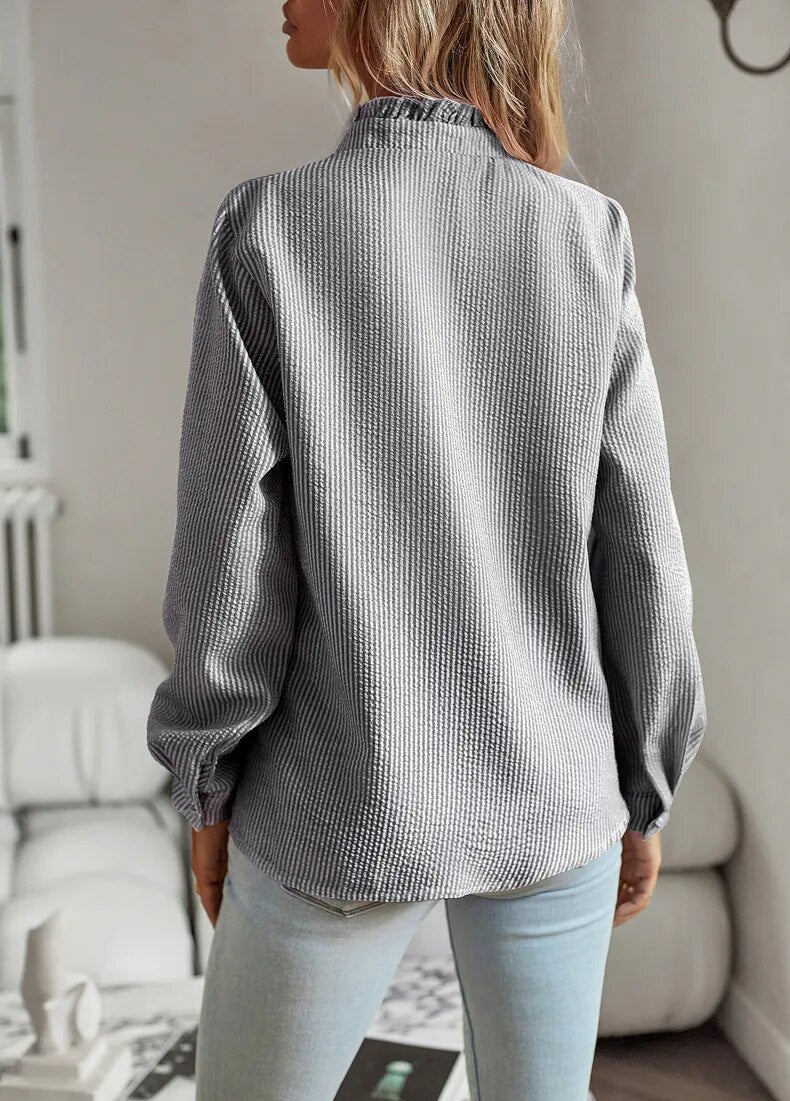 Ruffled button-up blouse for women